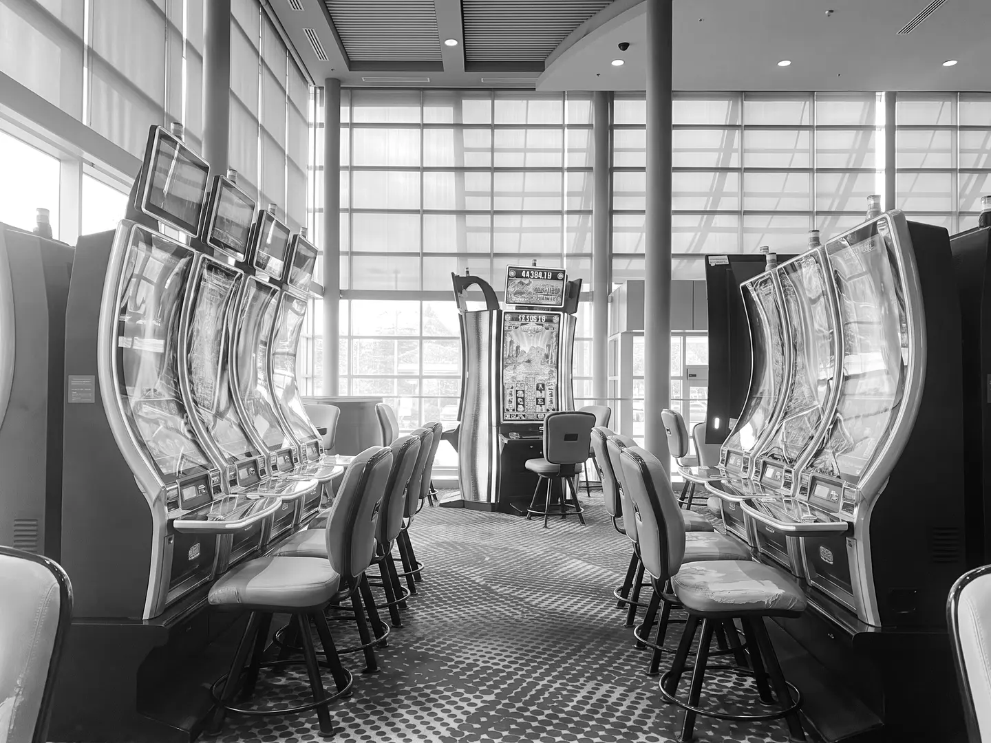 Slot aisle by the glass wall at Elements Casino Surrey