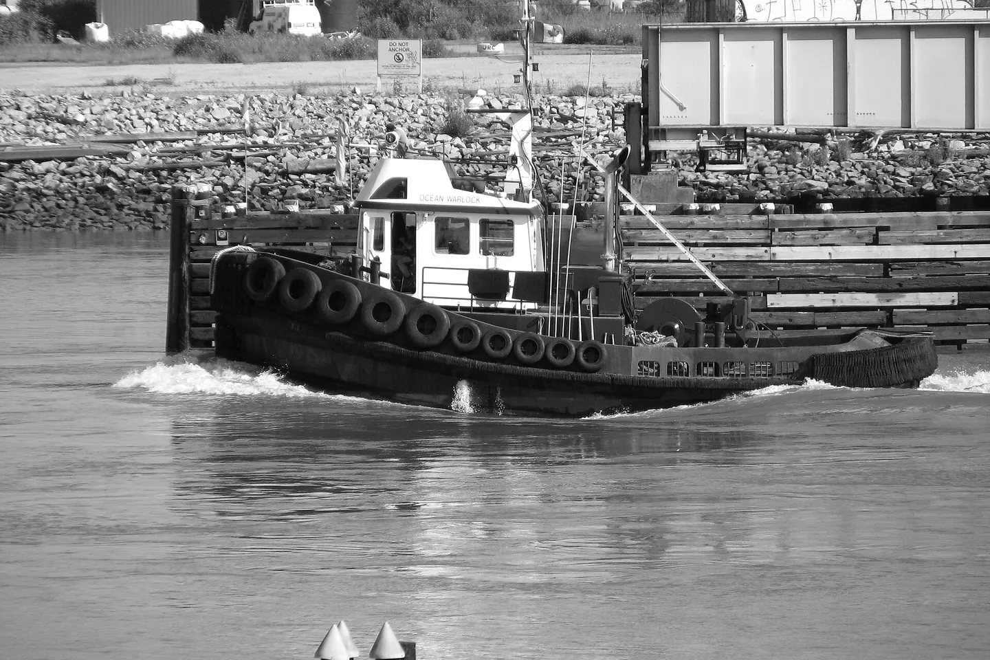 Tugboat passing the River Rock boardwalk